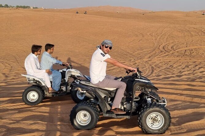 4 Hours Desert Tour with Quad Bike Camel Ride & Sandboard - Dune bashing with sandboard and sunset photos