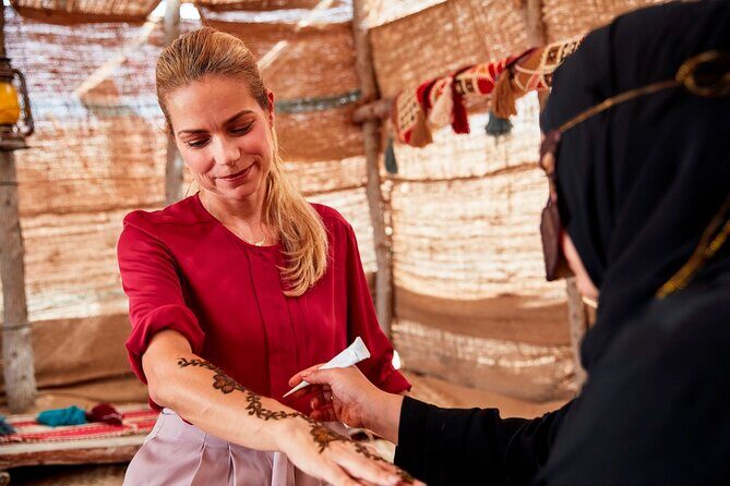 4x4 Desert Safari Abu Dhabi with BBQ Dinner - Arabian welcome: gahwa coffee, dates, and the camp mood shift