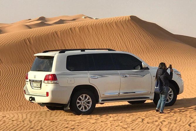 Abu Dhabi 4x4 Desert Safari BBQ Dinner , Camel Ride , Belly Dance - BBQ Dinner Under Stars: Unlimited Soft Drinks and Real Live Performances