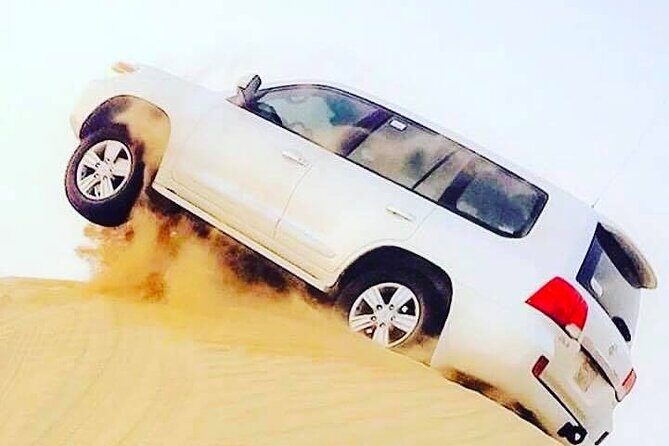 Abu Dhabi: 7-Hours Desert Safari with BBQ, Camel Ride & Sandboarding - Sunset Watching and Traditional Photo Moments