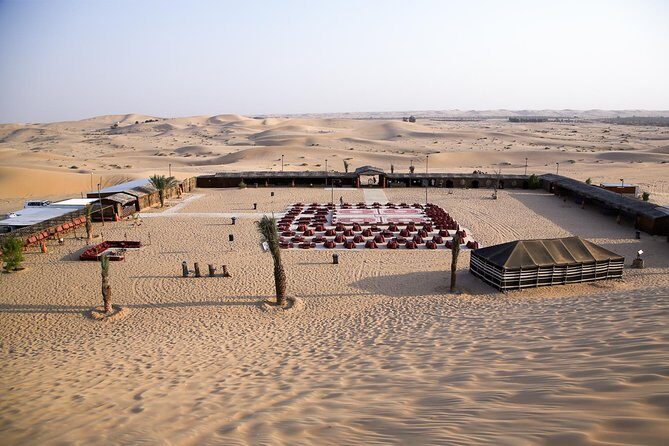 Abu Dhabi Desert Safari (Dune Bashing, BBQ Dinner, Camel Ride & Sand Skii) - Arabic camp night: henna, shows, and the BBQ dinner spread