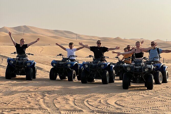 Abu Dhabi Desert Safari Tour with Shows & Buffet Dinner - Sandboarding plus a deep-desert sunset photo stop