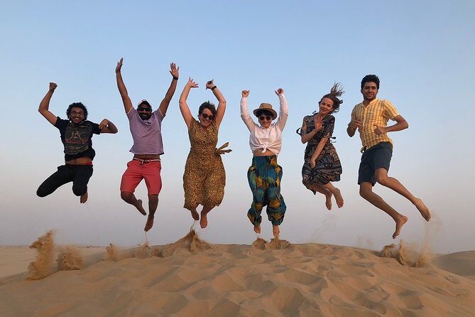 Abu Dhabi Desert Safari with BBQ Dinner & Shows - From hotel pickup to red-sand sunset in about 6 hours