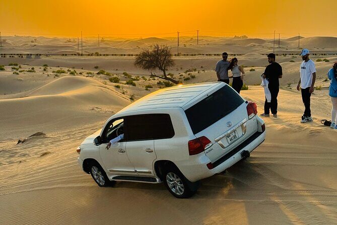 Abu Dhabi Desert Safari with Live Entertainment and Live BBQ - Bedouin-style camp: camel rides, sandboarding, and sunset time