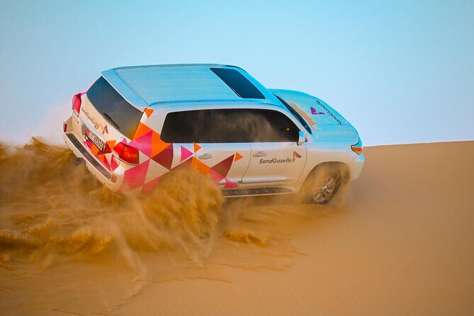 Abu Dhabi Evening Desert Safari - Dune bashing Camel ride and BBQ - Dune bashing in a safety-focused Land Cruiser
