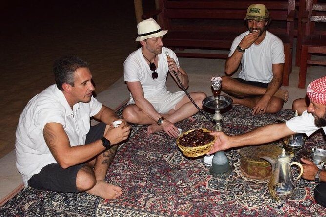 Abu Dhabi Evening Desert Safari with BBQ Dinner and all Camp Activities - Sandboarding: Sliding Down the Dunes You Just Rode