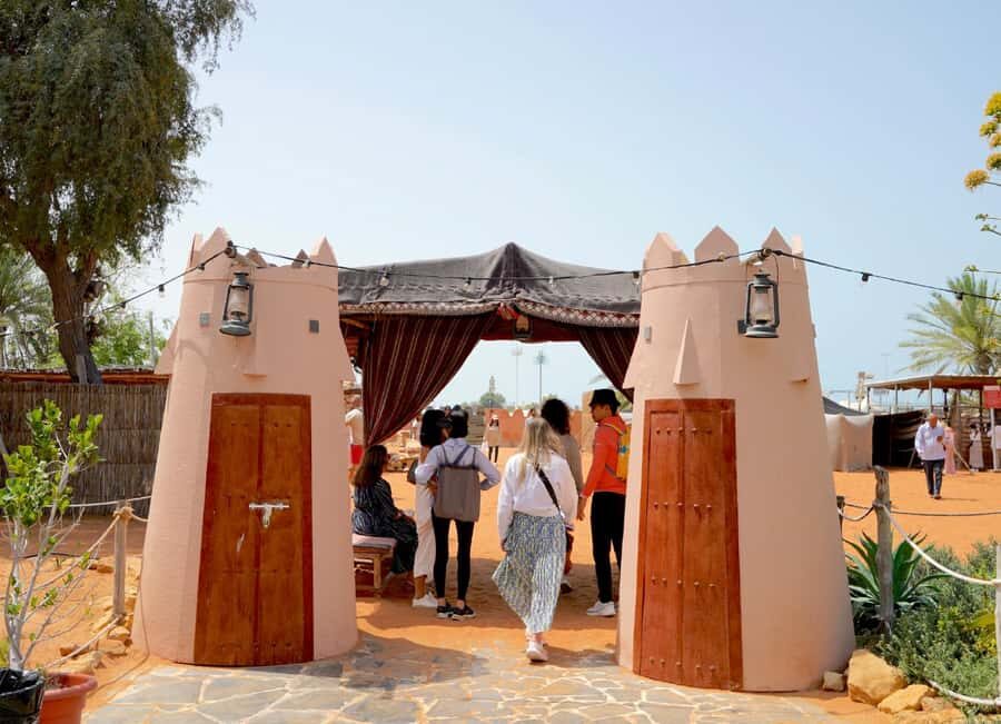 Abu Dhabi: Inside Heritage Village Walking Tour - Bedouin tents, fire pit, and the feel of desert life