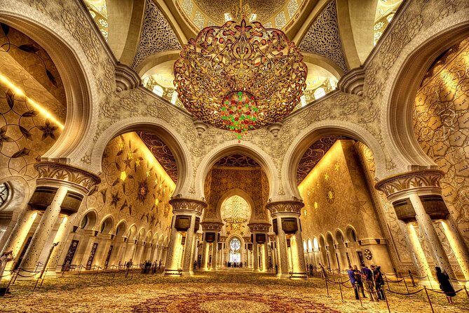 Abu Dhabi Mosque with Qasr Watn and Lunch at Emirates Palace - Sheikh Zayed Grand Mosque Center: where reflective pools meet strict dress rules