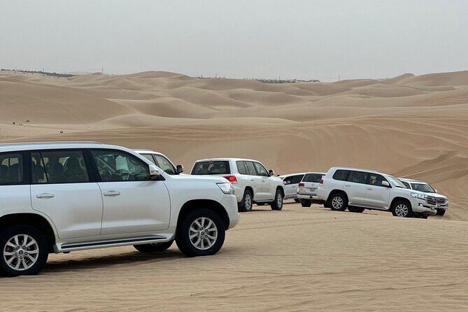 Arabian Desert Safari Abu Dhabi: 6Hour Tour with BBQ & Live Shows - Dune bashing at Al Khatim: Land Cruiser rides and the highest-point stop