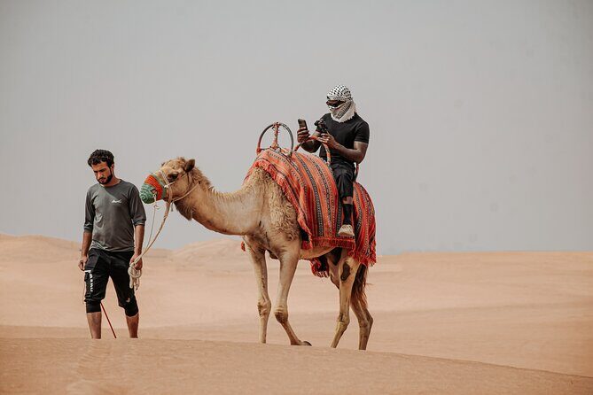 Combo Tour: Grand Mosque Visit & Dubai Desert Safari Experience - Lahbab Bedouin camp: camel ride, henna, sheesha, and BBQ