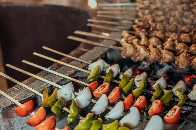 Deluxe Sunset Desert Safari: SandSurfing, Camel Ride & BBQ dinner - The Shows Under the Stars: Fire, Tanoura, and Belly Dance