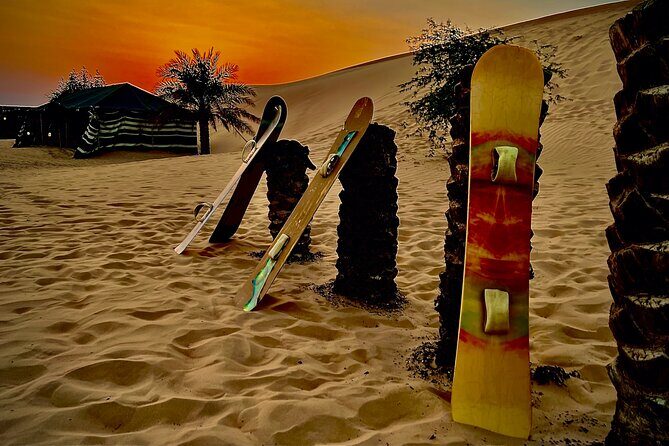 Desert Safari Abu Dhabi w/ Sand Boarding, Camel Ride & BBQ Dinner - Bedouin camp welcome: henna, UAE costume photos, camel riding, and sand boarding