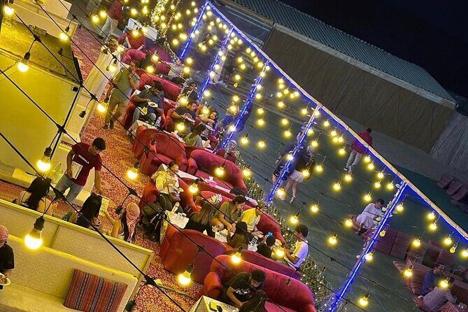 Desert Safari BBQ Dinner, Live Shows, ATV Bikes, Sandboarding - Sandboarding and camel ride: the classic desert moments that anchor the photos