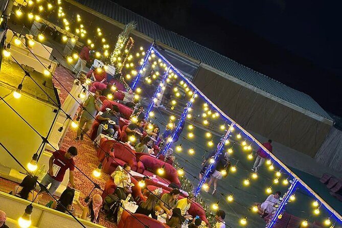 Desert Safari BBQ Dinner, Live Shows, ATV Bikes, Sandboarding - Belly dance, tanoura, and the fire show: the entertainment arc