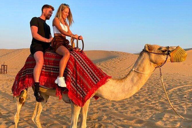 Desert Safari Dubai Tour with Dune Bashing, Camel Ride, & BBQ - Hotel pickup and the desert start: tea, dates, and getting ready