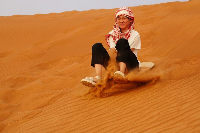 Desert safari Dubai with BBQ Dinner - Sandboarding on High Dunes: Easy Setup, Real Fun