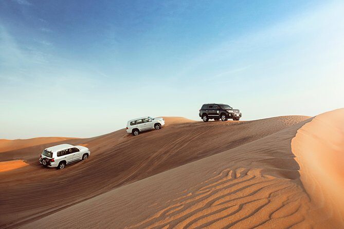 Desert Safari Dubai with Dune Bashing, Sandboarding, Camel Ride, 5 Shows, Dinner - Dune Bashing, Sandboarding, and Camel Riding: The Stuff You Actually Do