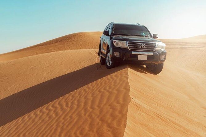 Desert Safari Dubai with Dune Bashing, Sandboarding, Camel Ride, 5 Shows, Dinner - Henna, Arabic Dress Photos, and Fire-Show Energy