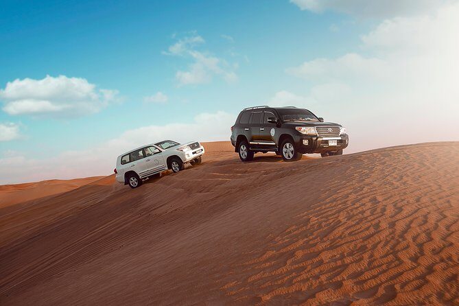 Desert Safari Dubai with Dune Bashing, Sandboarding, Camel Ride, 5 Shows, Dinner - Getting From Your Hotel to Al Awir in a 4x4