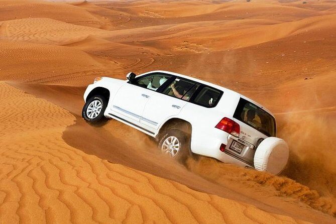 Desert Safari Dubai With Quad Bike ,camel Ride, bbq Dinner, Live Show's - Pickup in a 4x4, then photo stops on the way out