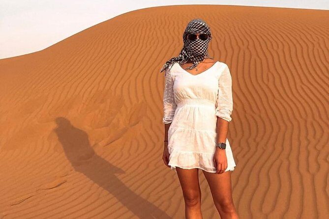 Desert Safari Red Dunes with Camel Ride, Sandboard, BBQ and Shows - Shows at night: Tanoura, belly dance, and the fire finale