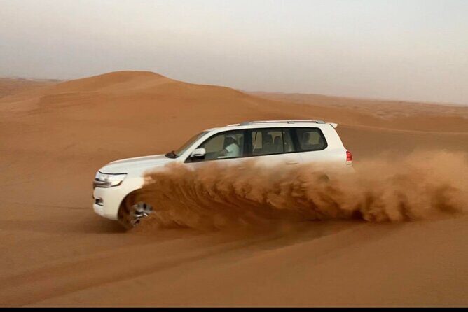 Desert Safari Tour with Camel Ride and BBQ Dinner in VIP Camp - Pickup to Lahbab: The Air-Conditioned Ride to the First Big Moment