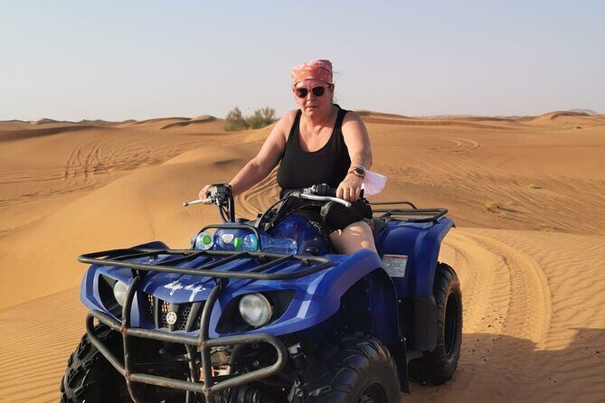 Desert Safari With 30 Mins Of Quad Bike Tour Camel Ride And BBQ - BBQ buffet dinner and live shows: belly dance, Tanoura, fire dance
