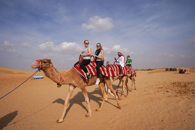 Desert Safari with Camel Ride, BBQ Dinner, Sand Board & Live Show - Dune Bashing and Sandboarding: The Main Event