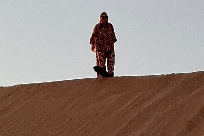 Desert Safari with Dune Bashing and Camel Ride plus Sand Boarding - Henna, falcon photos, and costume moments you can plan around