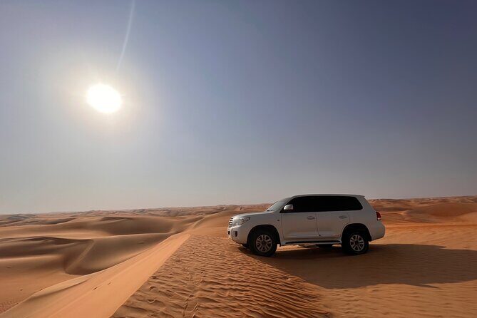 Desert Safari with Dune Bashing and Camel Ride plus Sand Boarding - Camel farm stop and the transition to the camp