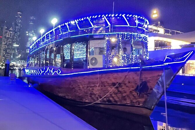Dhow Cruise with Dinner at Dubai Marina - A dhow on Dubai Marina’s neon edge