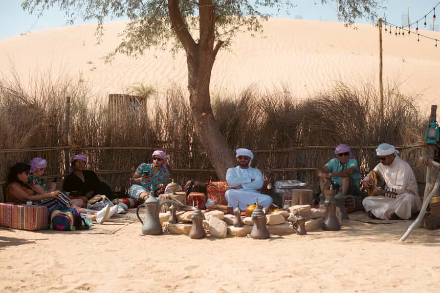 Dubai: Al Marmoom Oasis Camp Experience with Bedouin Dinner - Bedouin activities: falcon photos, henna for ladies, and traditional clothing