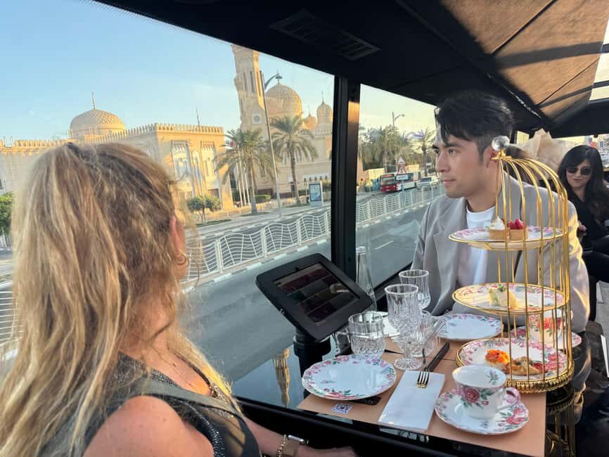 Dubai: Bustronomy Panoramic Afternoon Tea City Tour - Golden hour sightseeing from a panoramic glass-roof bus