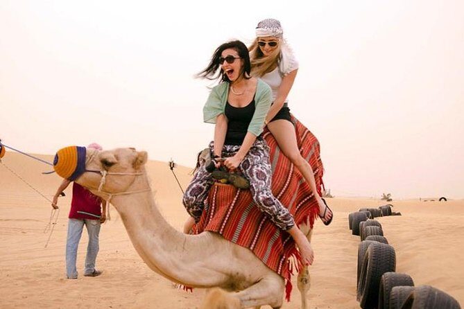 Dubai City Tour and Evening Desert Safari BBQ Dinner- Combo Tour - Bedouin camp BBQ dinner: henna, sheesha, and three show segments