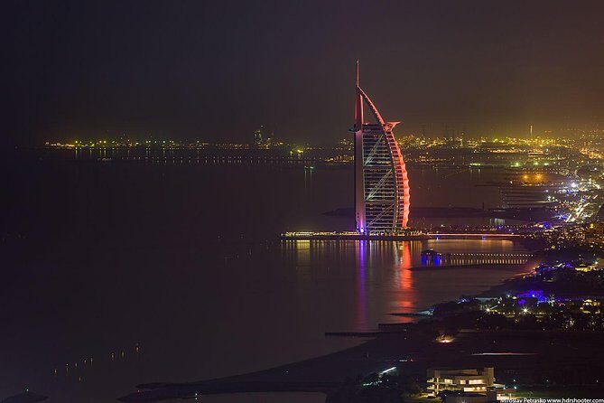 Dubai City Tour By Night With Burj Khalifa Ticket - Sheikh Zayed Road drive-by: luxury car showrooms and big-city momentum