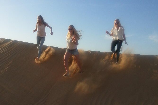 Dubai Desert Afternoon Quad Safari with Camel Ride, BBQ Dinner and Belly Dancing - Sunset photo breaks: why that afternoon timing pays off