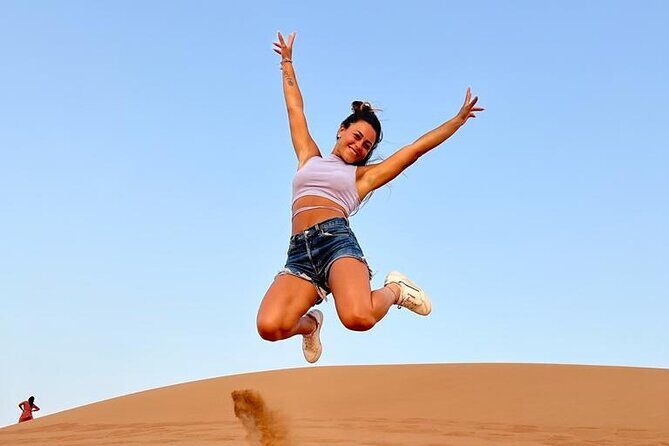 Dubai: Desert Safari 4x4 Dune with Camel Riding and Sandboarding - Belly dance, tanoura, fire show, and the rest of the night program