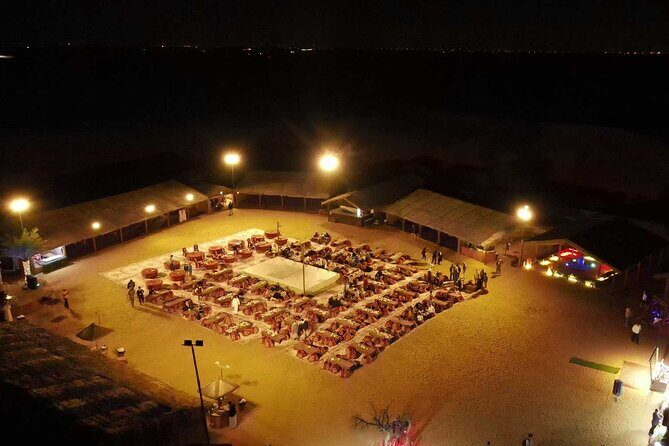 Dubai: Desert Safari, Camel Ride, Show & Optional Dinner - Camel ride, falcon moments, and sandboarding at the camp