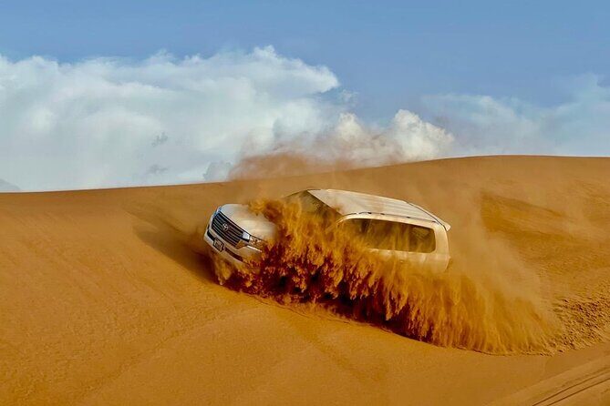 Dubai Desert Safari: Dune Bashing, Camel Ride, Sandsurf & 5<em> BBQ – Key things to know’ /></p>
<ul>
<li><strong>Lahbab dune bashing plus sandboarding and a photo stop</strong> before you head to camp</li>
<li><strong>Camel ride and camel feeding</strong> included, with the ride noted as repeatable</li>
<li><strong>Falcon expert time, henna for ladies, and Arabian attire makeovers</strong> for photos</li>
<li><strong>Live shows all evening</strong>: Tanoura, fire show, belly dance, and Ladies Khaliji Dance</li>
<li><strong>Unlimited cold mineral water and soft drinks</strong> plus tea/coffee, dates, and sweets at the camp</li>
</ul>
<h2 id="lahbab-pickup-to-dune-bashing-where-the-safari-actually-gets-real">Lahbab Pickup to Dune Bashing: Where the Safari Actually Gets Real</h2>
<p><img width="669" height="446" decoding="async" src=