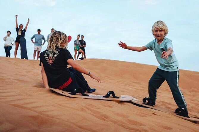 Dubai Desert Safari Experience with Dinner Dune Bash Sand Surfing - Belly dance, Tanoura, and fire shows: how to enjoy the stage seating
