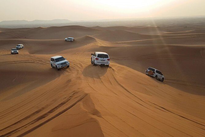 Dubai Desert Safari, Quad Bike, Camel Ride, and Buffet Dinner - Henna, local attire trial, and shisha time under the stars