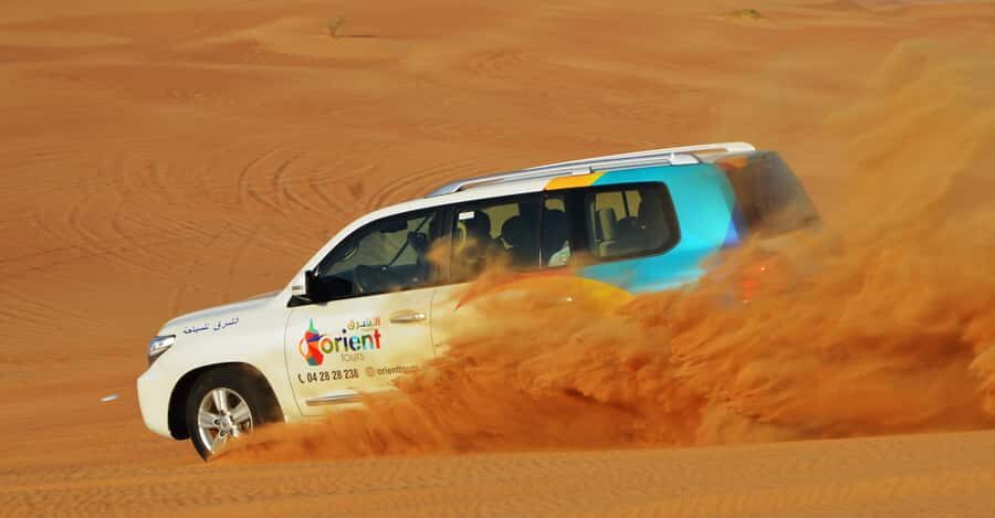 Dubai Desert Safari, Quad Biking, Camel Ride, & Sandboarding - Entering Dubai’s desert world from pick-up to dune drive