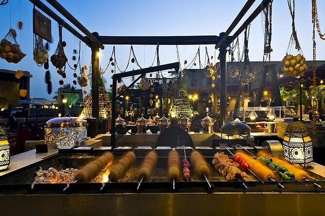 Dubai Desert Safari Red Dune: BBQ, Camel Ride & Sandboarding - Belly Dance, Tanura, and Fire Shows at BBQ Dinner Time