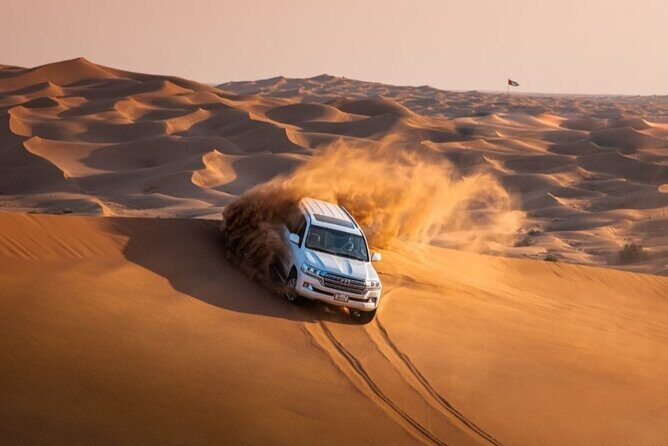 Dubai Desert Safari with Camel Ride, Sand surf, & BBQ Dinner - Entering the Desert With Pickup and a Small-Group Feel