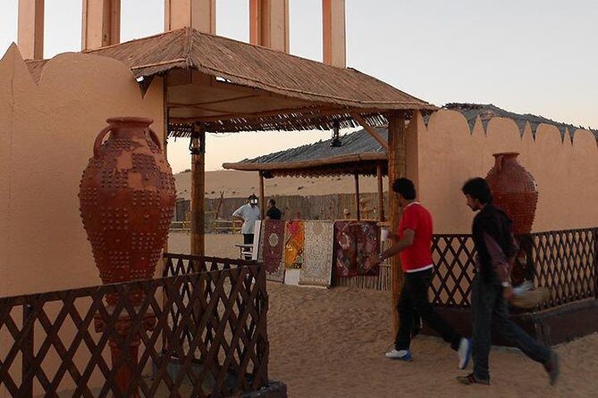 Dubai Desert Safari with Camel Ride, Show, BBQ and Transfers - Camel ride, henna, shisha, and Arabic costume photos