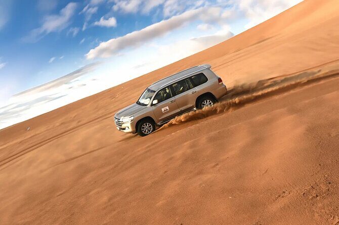 Dubai Desert Safari with Dune Bashing & Live Shows - Sandboarding and the dune meeting point: included fun plus optional extras