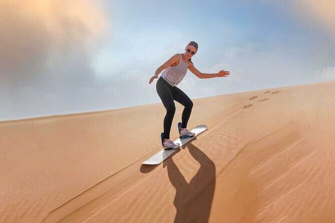 Dubai: Desert Safari With Quad Bike, Camel Ride & Dinner - Entering the dunes: dune bashing and sandboarding at RAH Desert Camp