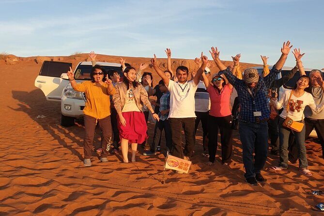 Dubai Desert Safari With Sandboarding & Camel Riding - Camp arrival: Arabic coffee, legemat, camel riding, and henna