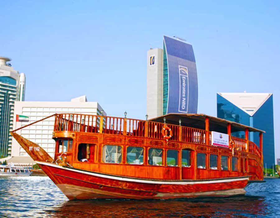 Dubai: Dhow Dinner Cruise on Creek or Marina with Live Shows - Boarding the dhow: what “traditional boat” means in practice