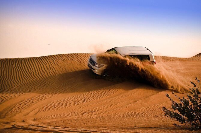 Dubai Dune Bashing Safari With BBQ Dinner, Entertainment and Camel Ride - BBQ dinner plus fire, Tanoura, and belly dance: what your evening becomes